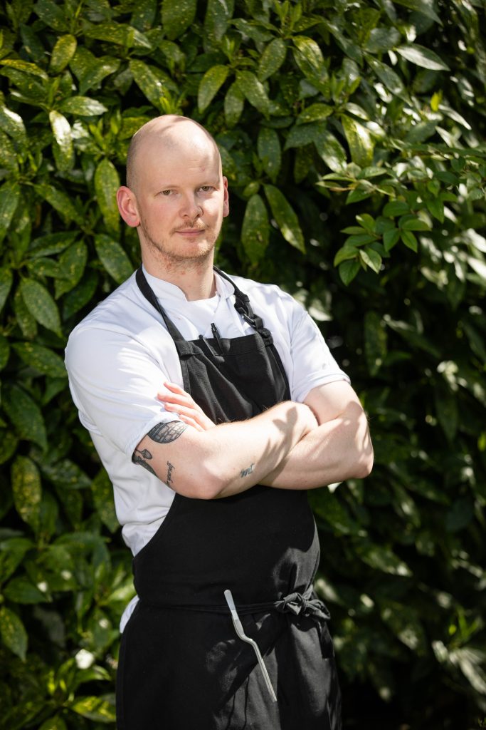 Chef Matthew Holdsworth House Hotel standing in the gardens