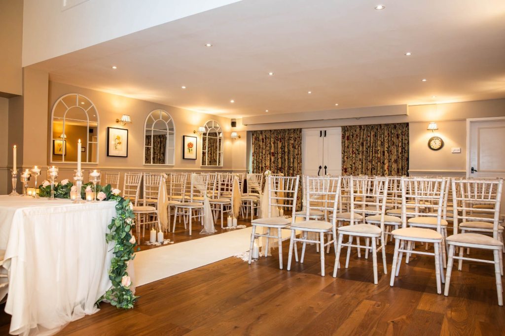 Indoor wedding ceremony set up at Holdsworth House.