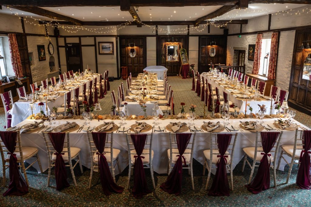 Large wedding breakfast set up inside Holdsworth House.
