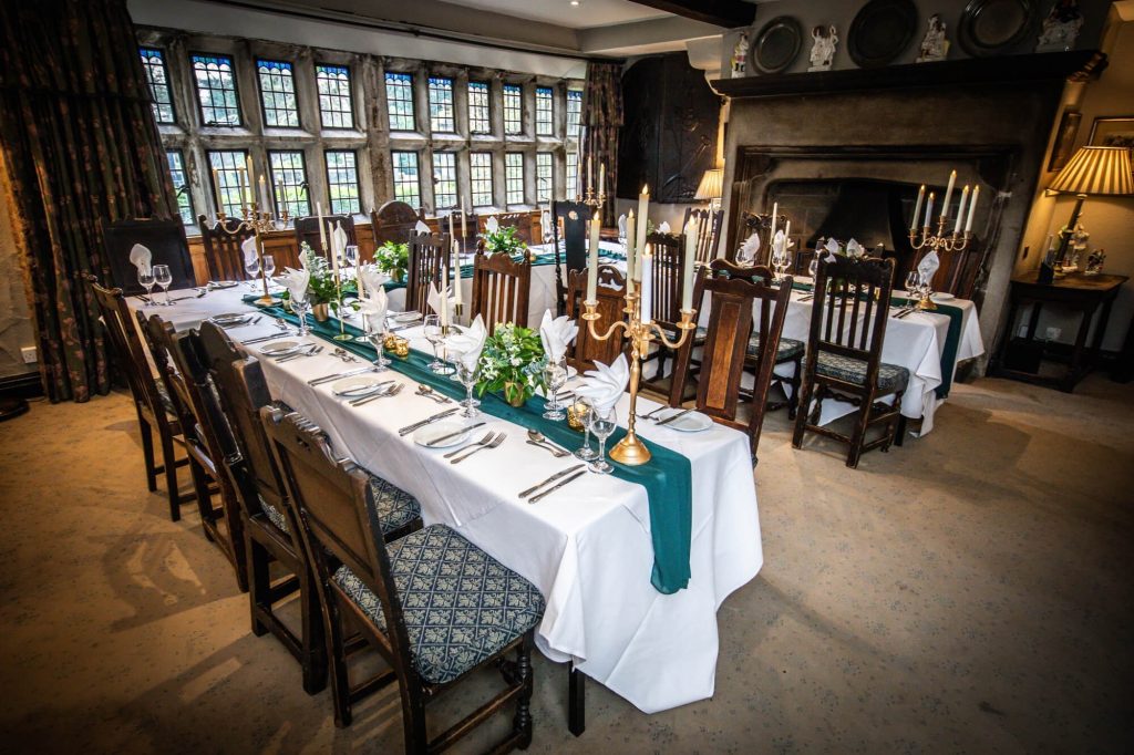 Wedding breakfast set up in a historic dining room at Holdsworth House.