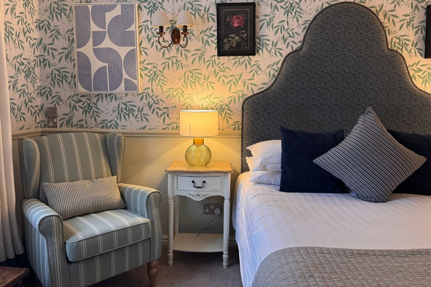House double bedroom at Holdsworth House with upholstered armchair and traditional headboard