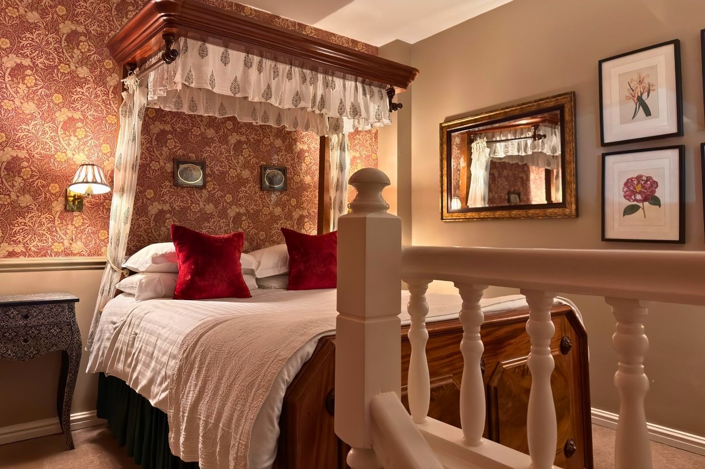 Upper bedroom in a split-level suite at Holdsworth House with traditional half-tester bed