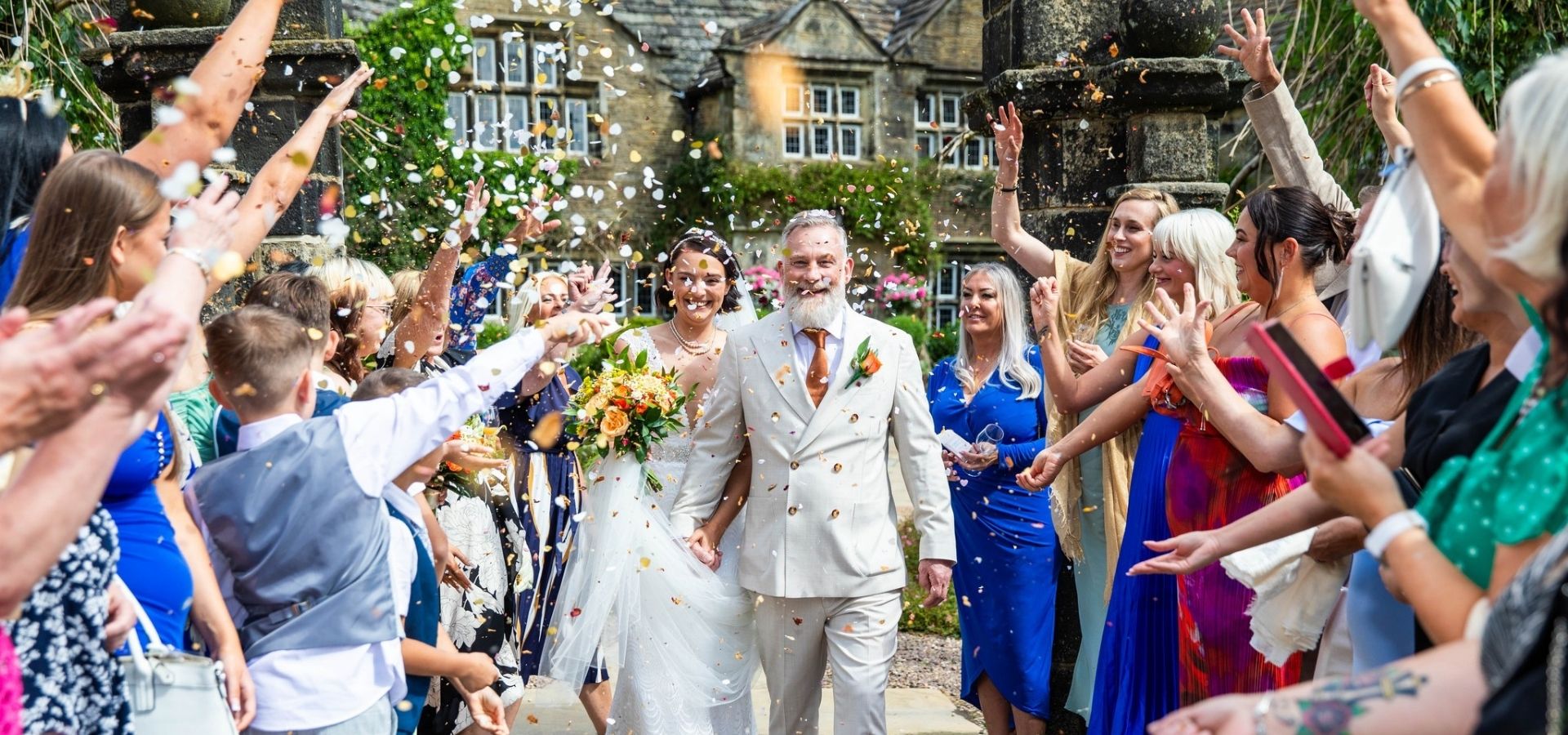 a happy couple on their wedding day at Holdsworth House