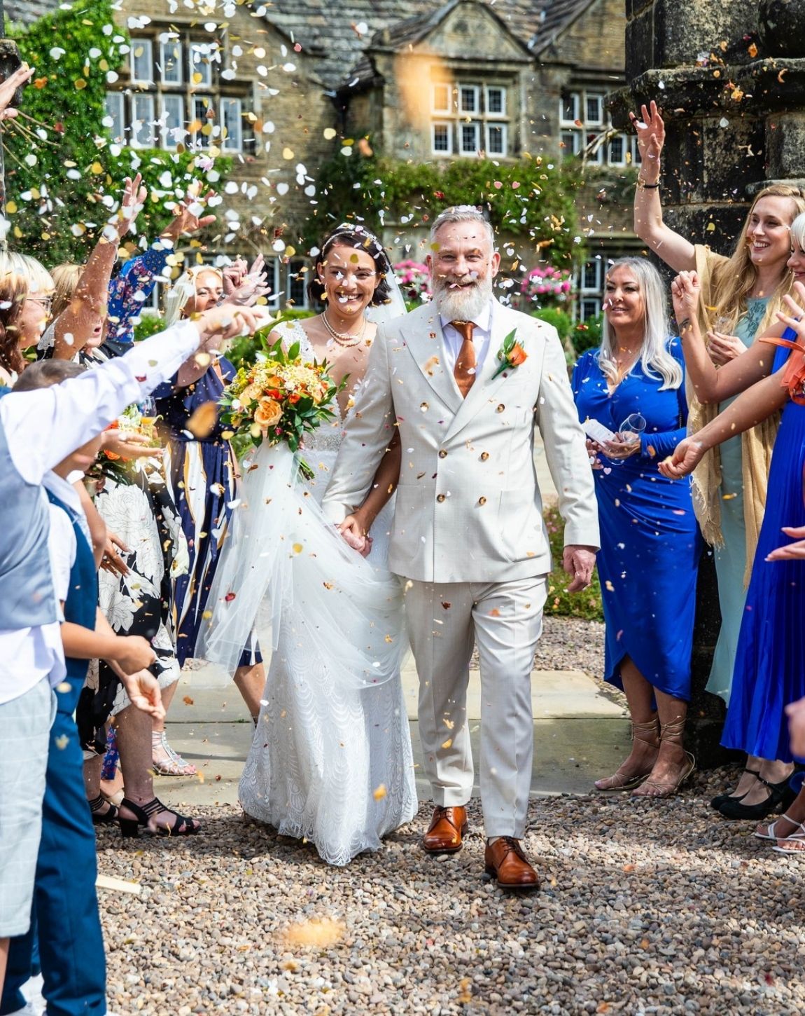 a happy couple on their wedding day at Holdsworth House