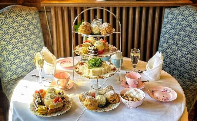 Traditional afternoon tea with sandwiches, cakes and scones at Holdsworth House
