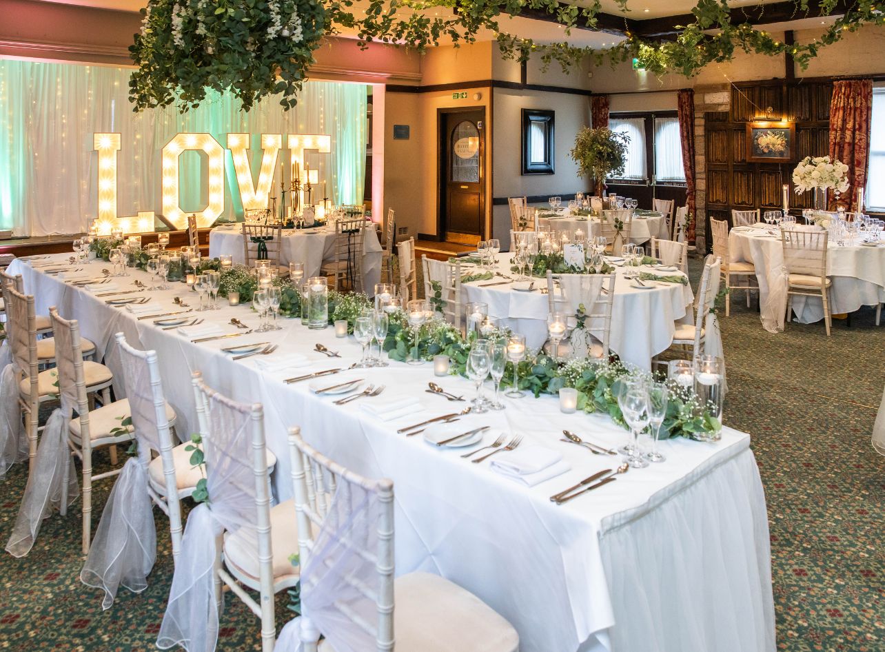 Long tables dressed for a wedding breakfast