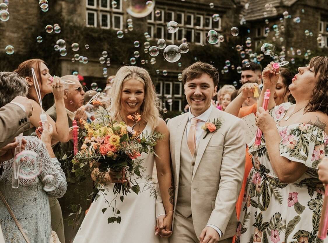 wedding venue in Halifax bride and groom smiling and bubbles floating around