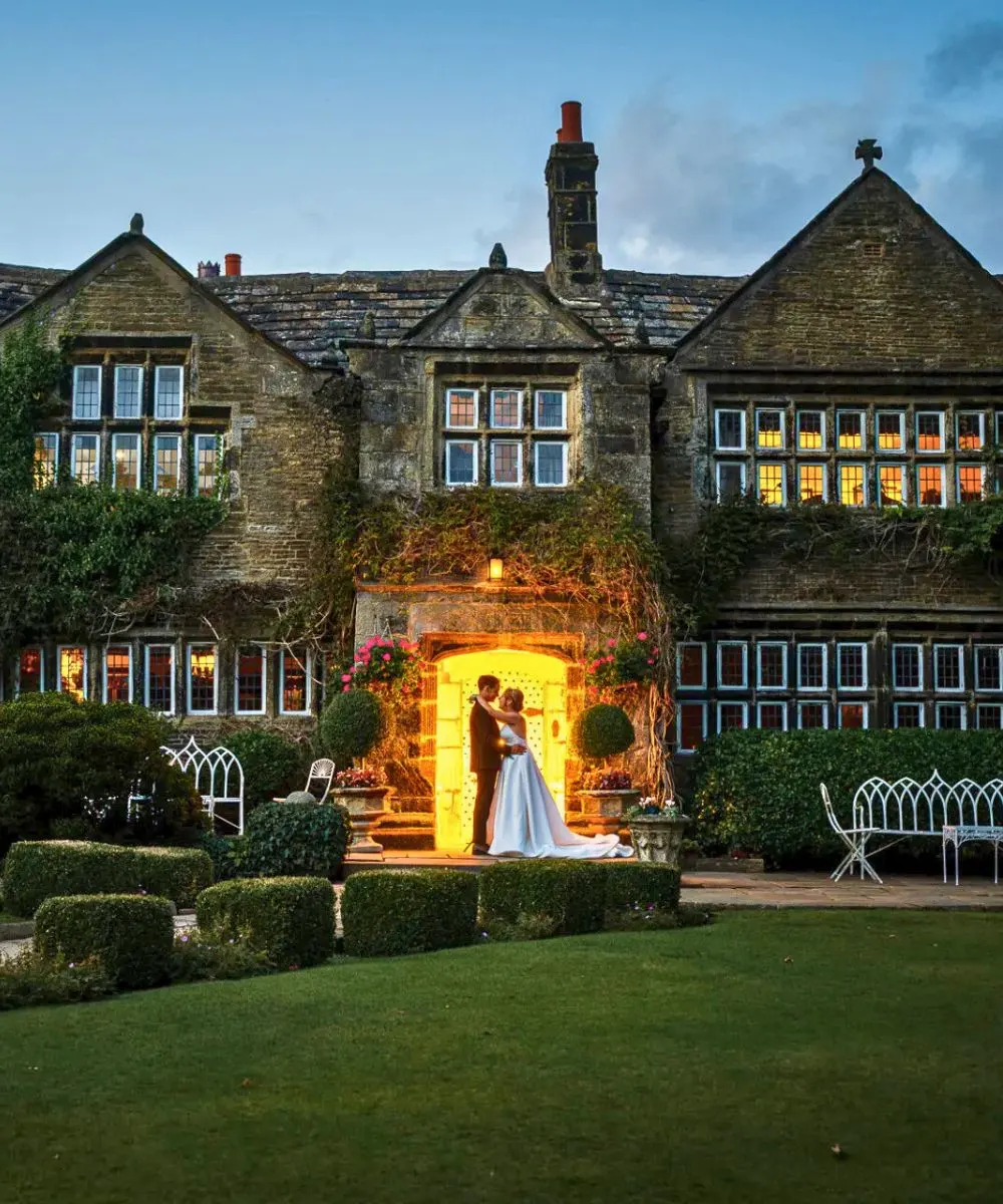 Bride and groom at a Twilight wedding at Holdsworth House Hotel