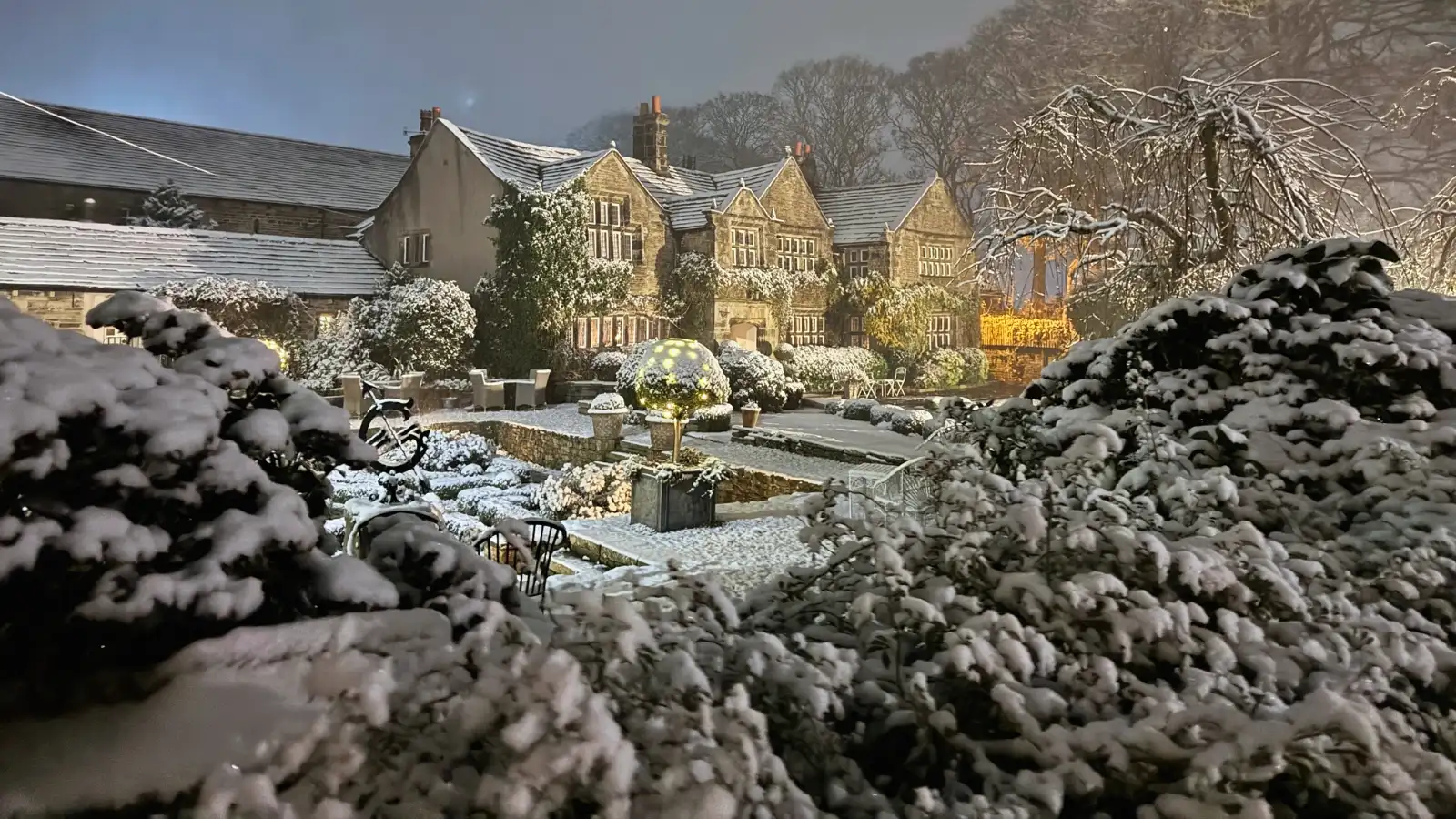 Holdsworth House lit up for an evening winter wedding