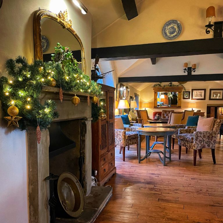 Holdsworth House gift vouchers by the fire