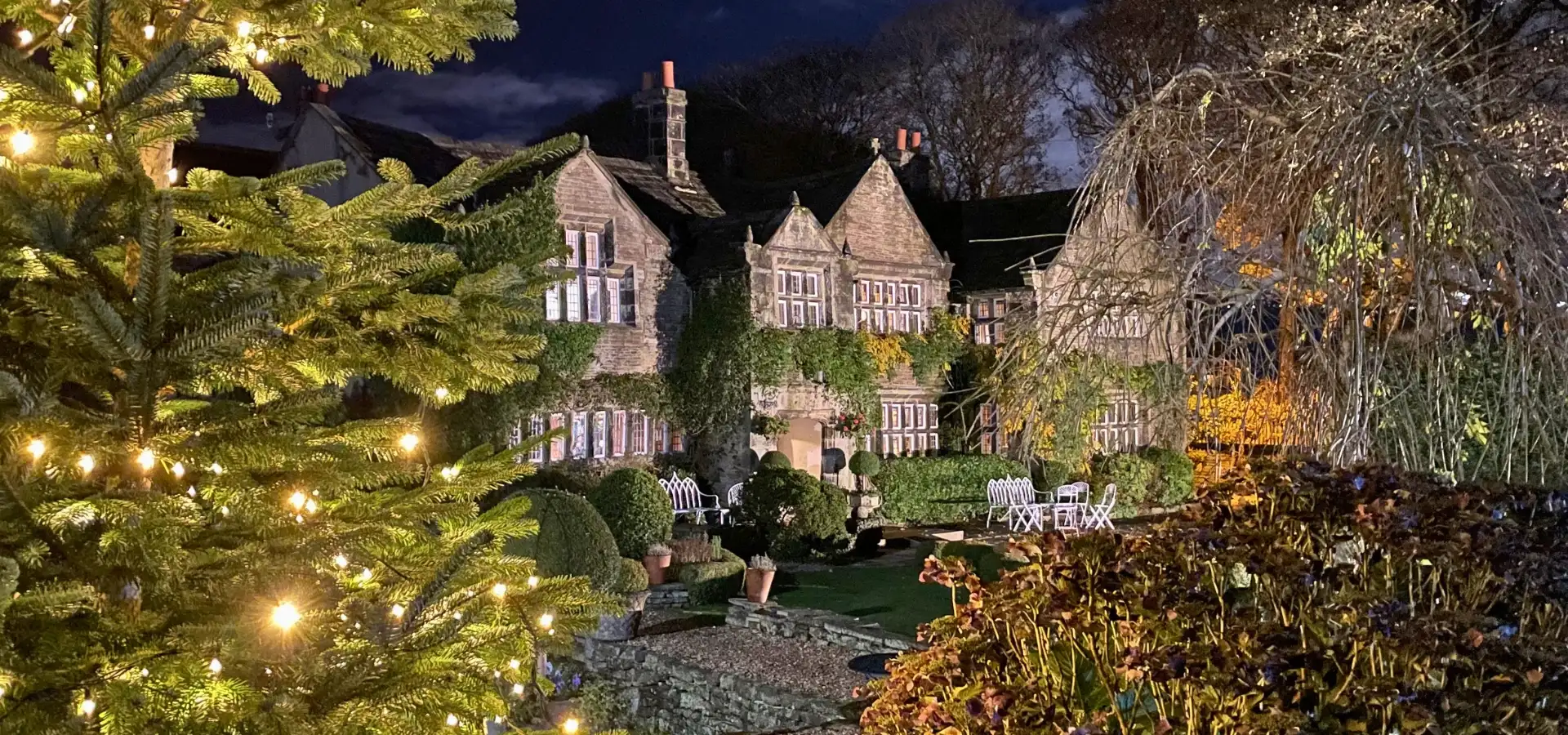 Candlelit restaurant laid for Christmas at Holdsworth House