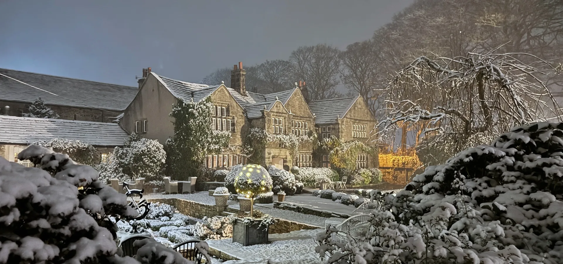 Holdsworth House in the snow at dusk, Christmas