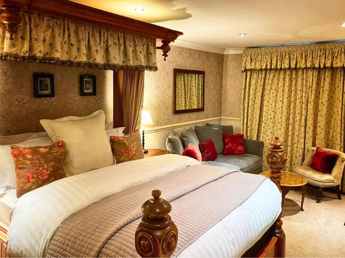A cosy bedroom dressed for winter at Holdsworth House