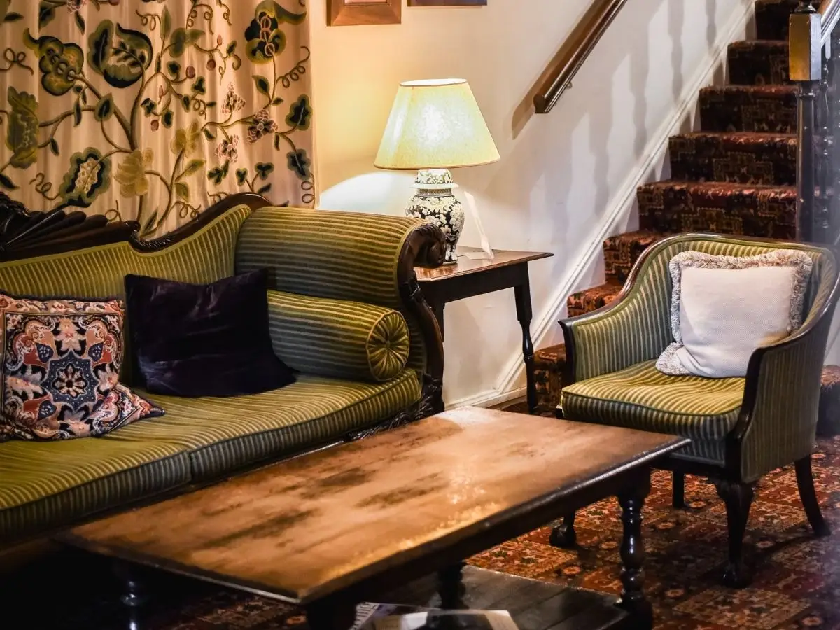The lounge and the staircase at Holdsworth House