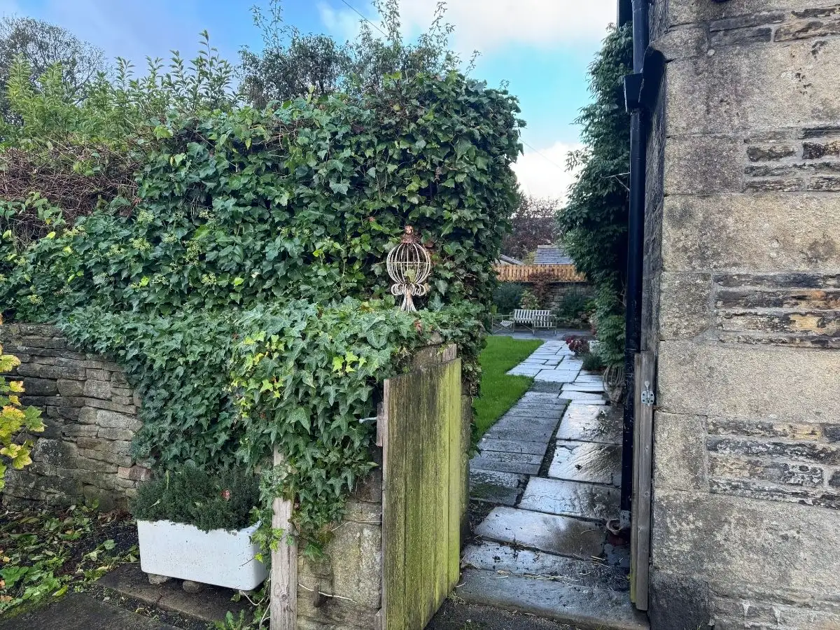 The gate and the path to The Farmhouse, ivy on the stone