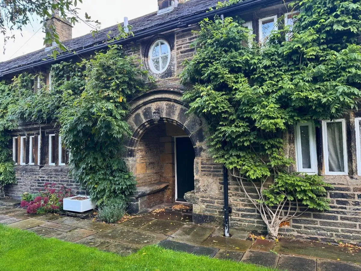 The Farmhouse from the lawn, ivy over the stone