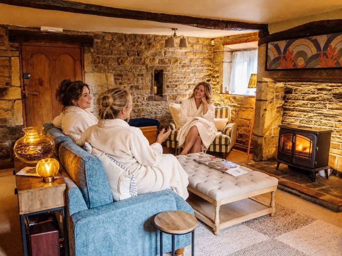A group in robes with the Farmhouse lounge to themselves