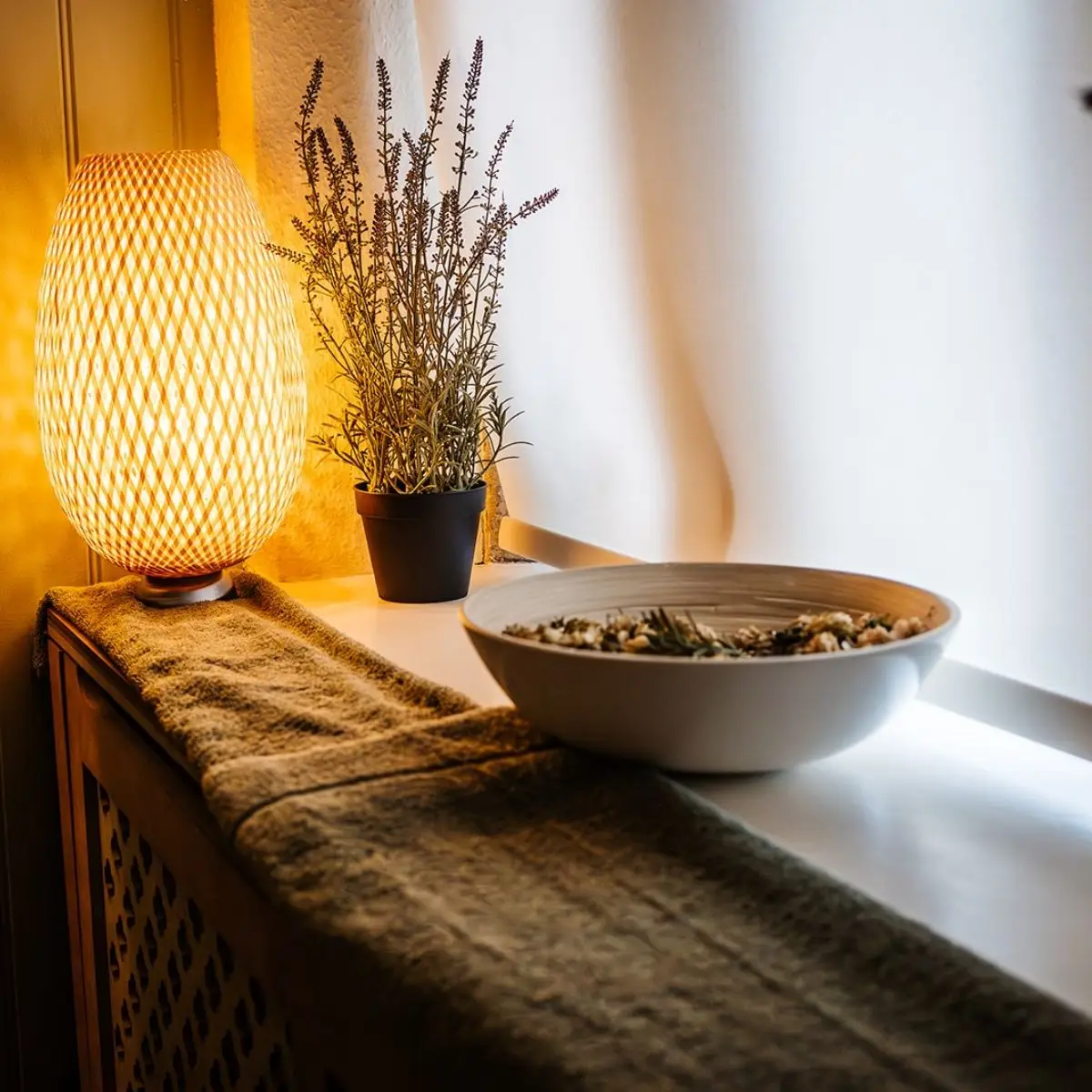 Lavender and a lamp on the sill
