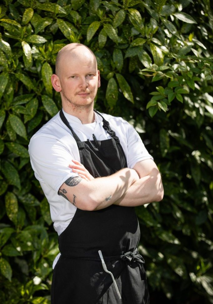 Chef Matthew Holdsworth House Hotel standing in the gardens